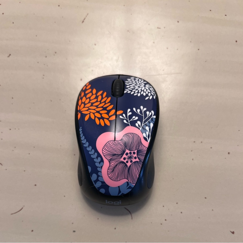 Logi wireless computer mouse with USB attachment